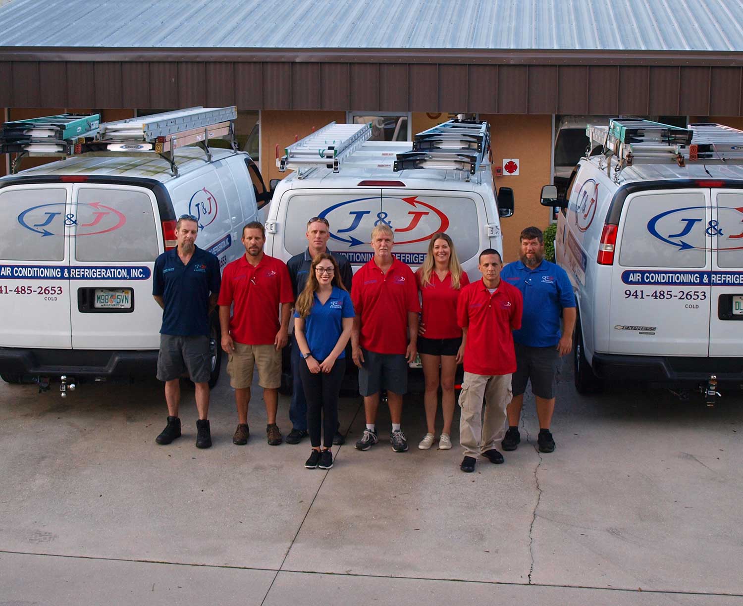 j&j team in front of the work van fleet